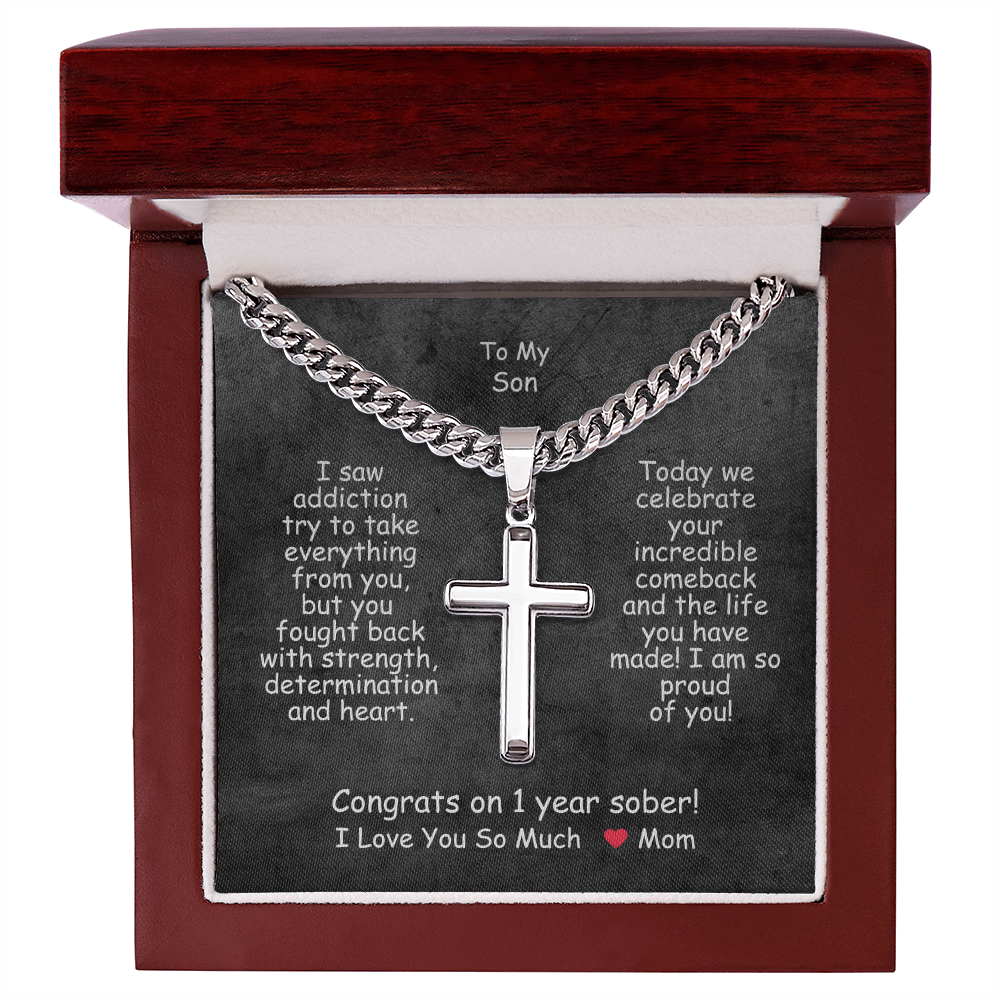 Cross pendant necklace in a red gift box with black message insert.