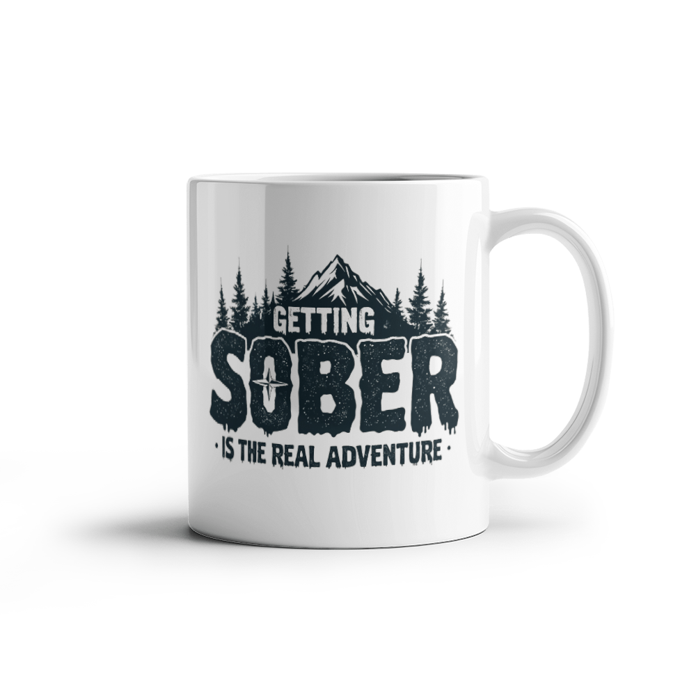 White ceramic mug on white background with black 'GETTING SOBER' text
