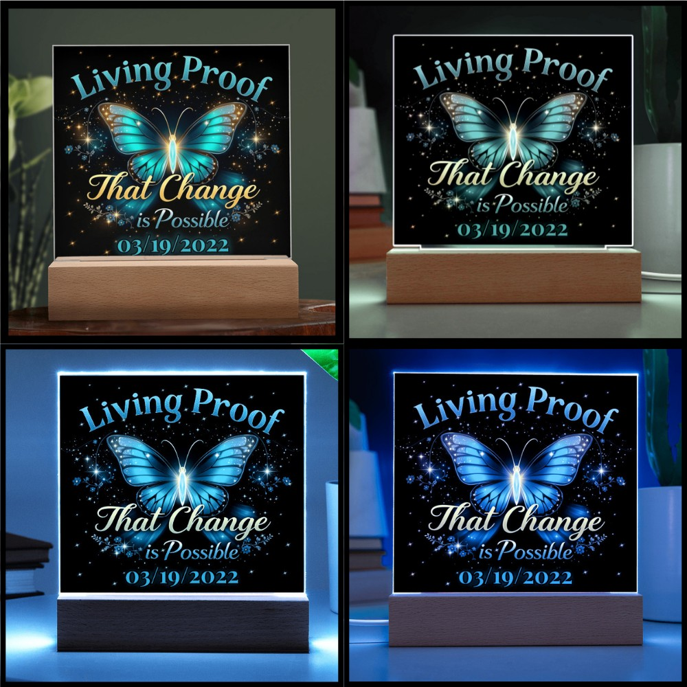LED acrylic plaque on wood base shown in multiple light colors with butterfly design