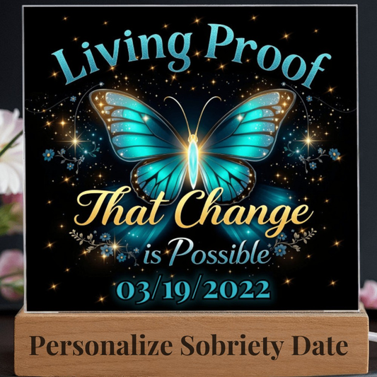LED acrylic plaque with teal butterfly glow, 'Living Proof That Change is Possible 03/19/2022'