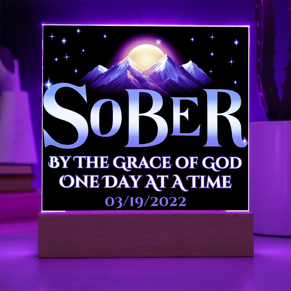 Acrylic LED plaque on a wooden base with printed memorial design and purple lit frame