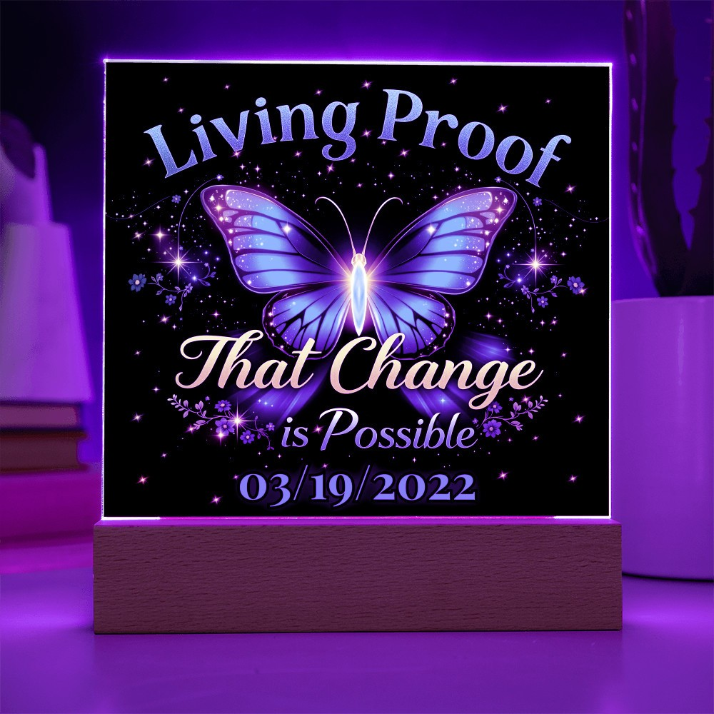 LED acrylic plaque with purple butterfly glow and 'Living Proof That Change is Possible 03/19/2022'