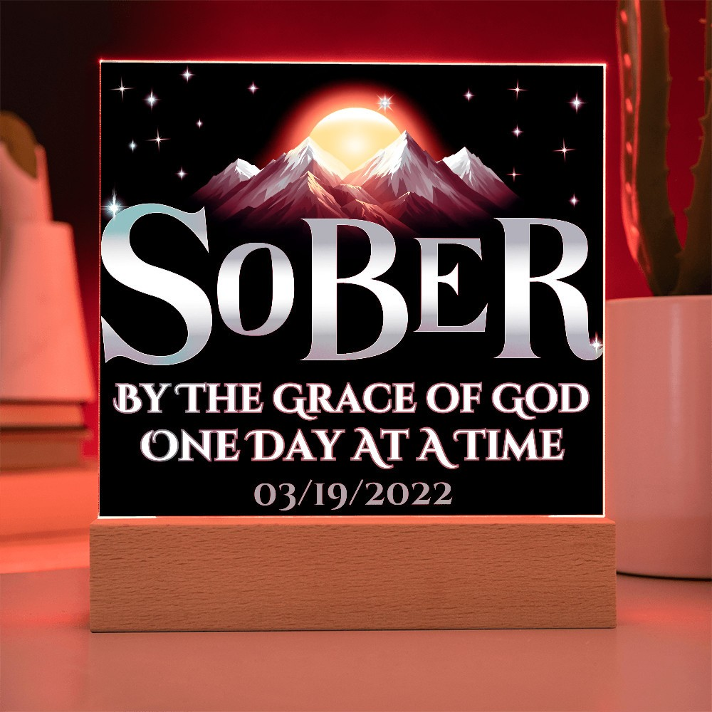 Acrylic LED plaque on a wooden base with printed memorial design and red lit frame