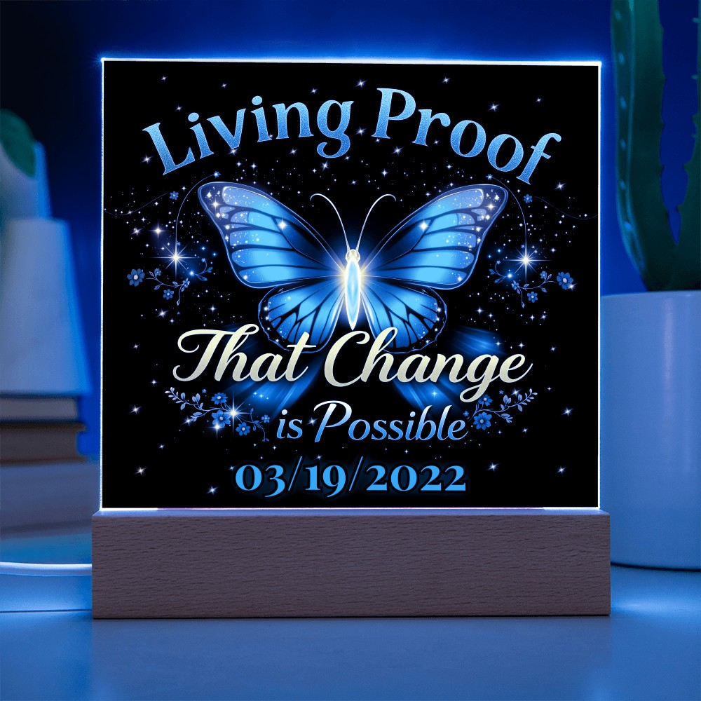 LED acrylic plaque with blue butterfly glow, 'Living Proof That Change is Possible 03/19/2022'