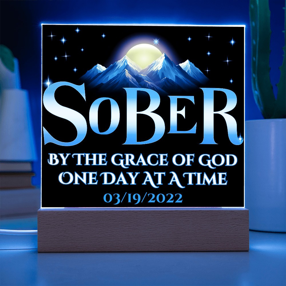 Acrylic LED plaque on a wooden base with printed memorial design and blue lit frame