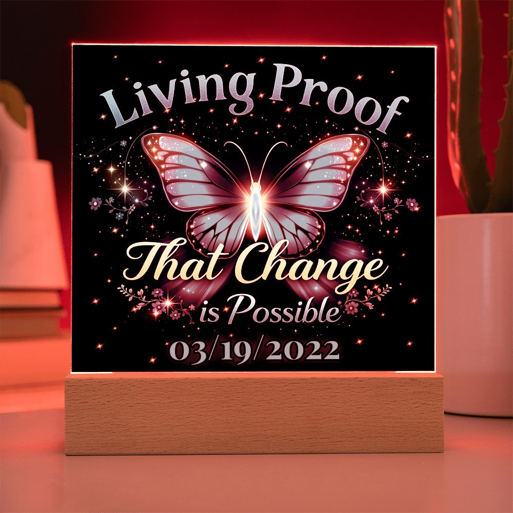 LED acrylic plaque with red butterfly glow and 'Living Proof That Change is Possible 03/19/2022'