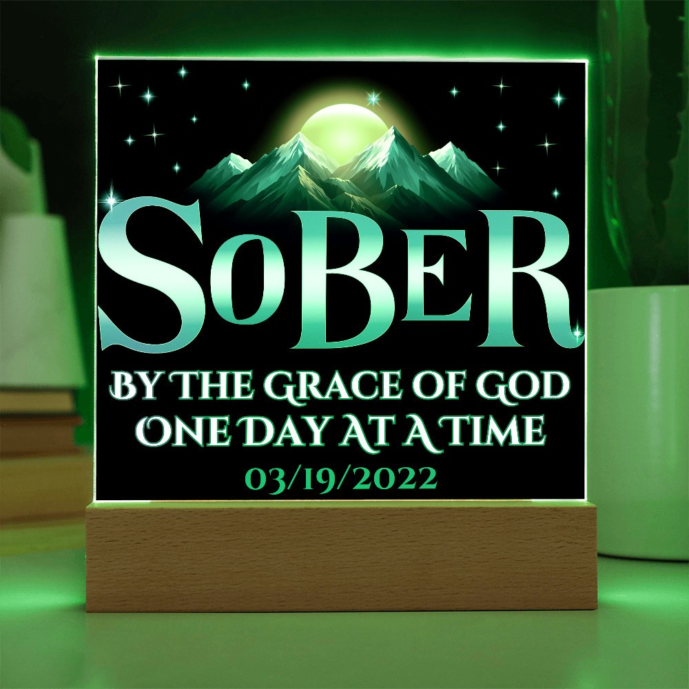 Acrylic LED plaque on a wooden base with printed memorial design and green lit frame