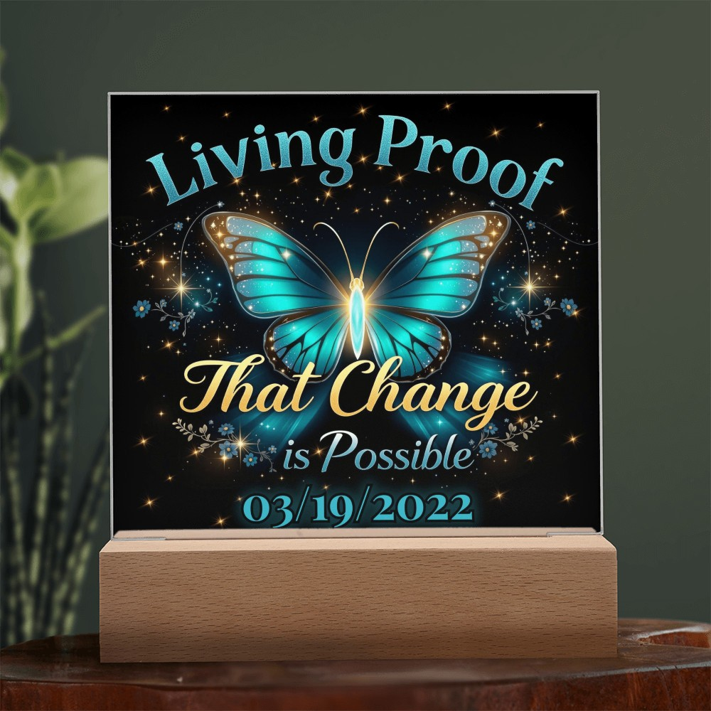 LED acrylic plaque with teal butterfly glow and 'Living Proof That Change is Possible 03/19/2022'