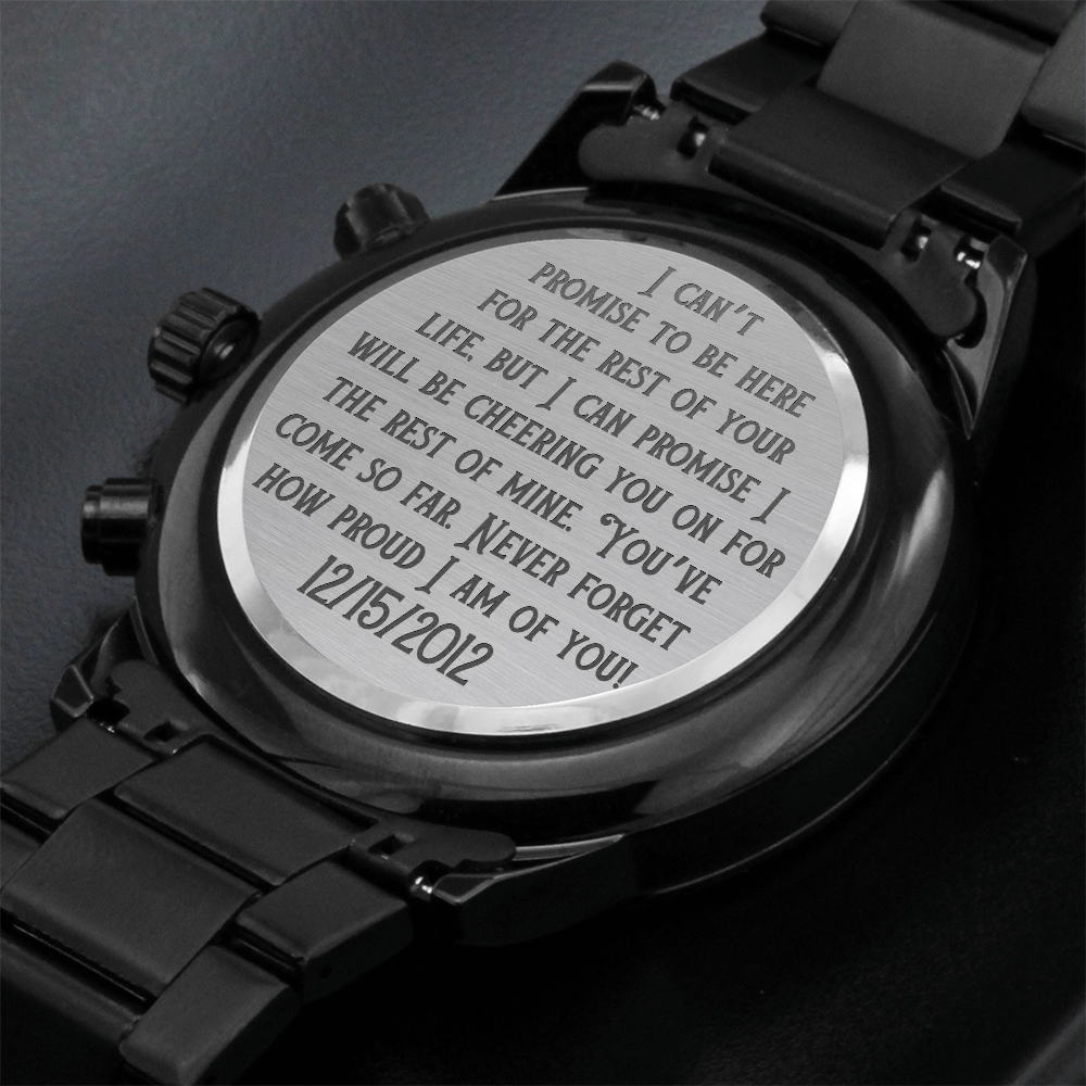 Black metal wristwatch with engraved sentiment medallion on the caseback
