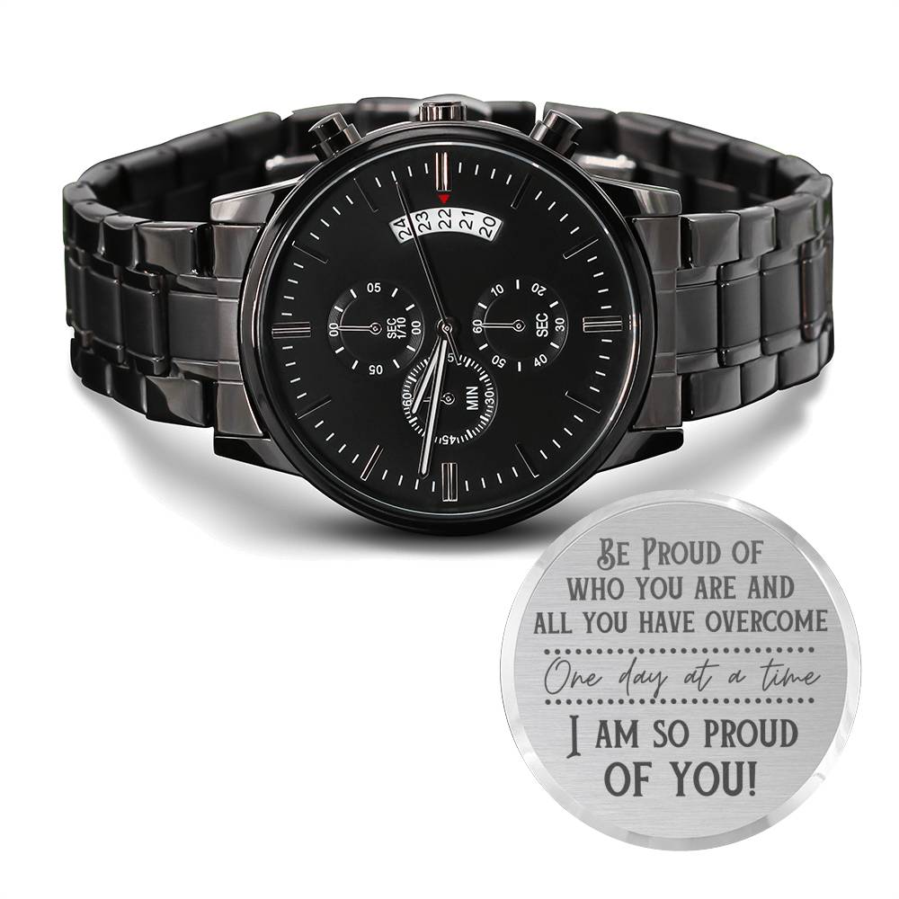 Men's recovery watch with black metal bracelet, black dial, and engraved gift disc