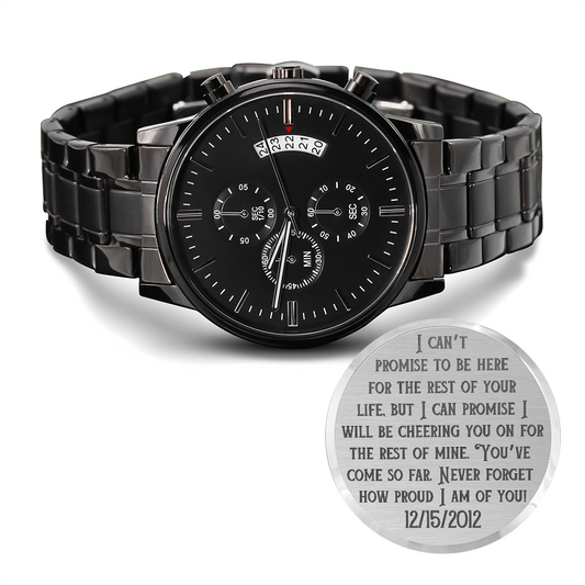 Black metal chronograph wristwatch with engraved circular sentiment plate