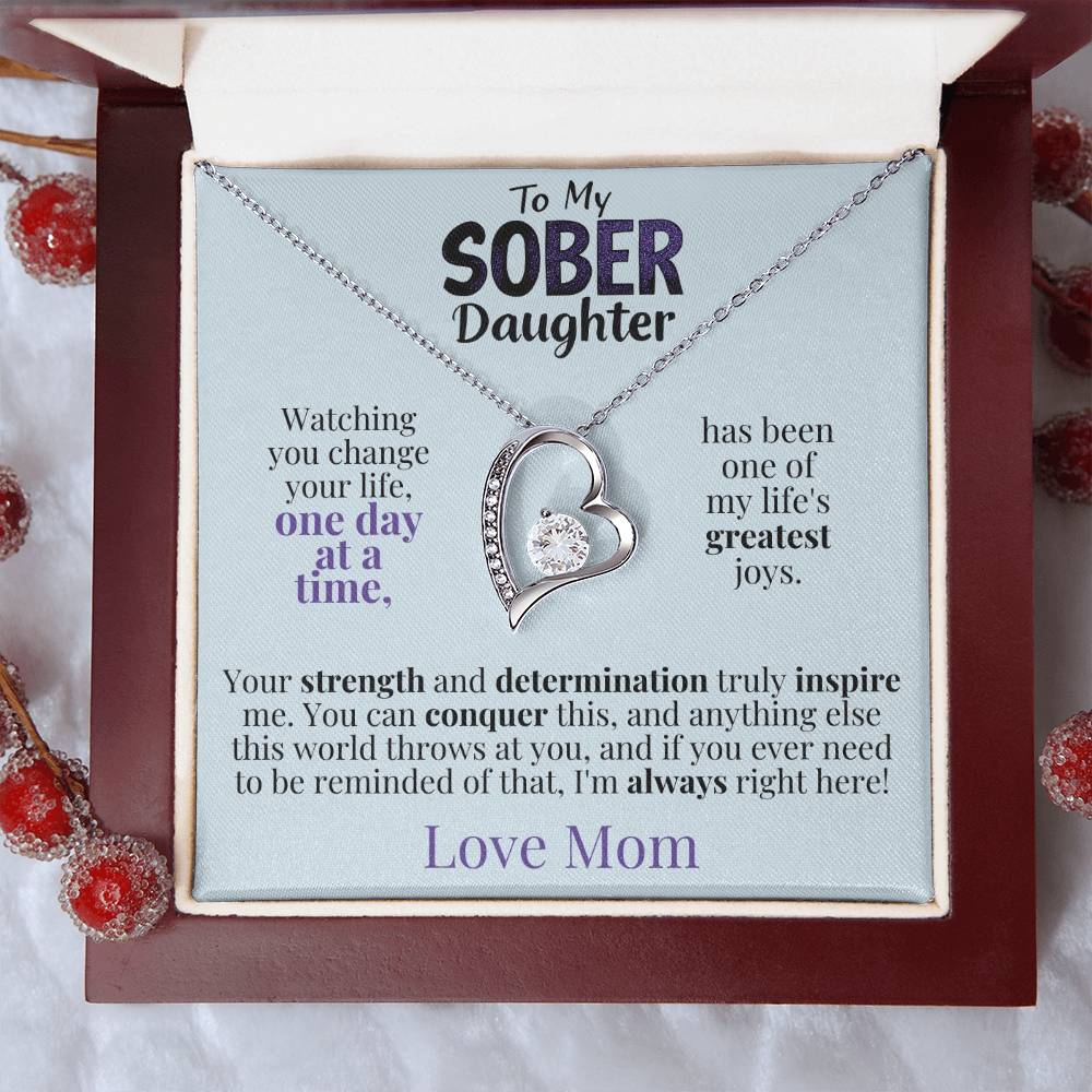 Heart pendant necklace in an open gift box with printed message card