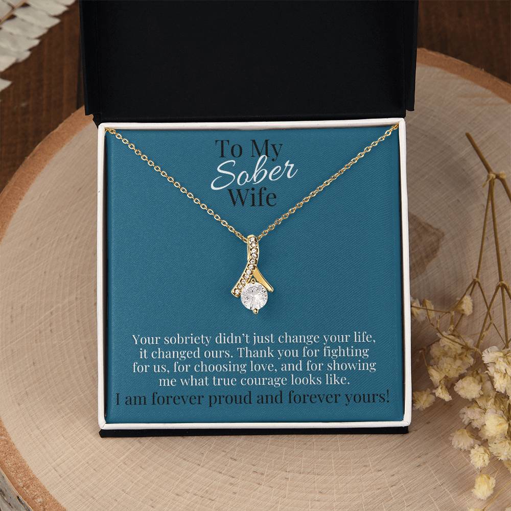 Gold-tone teardrop pendant necklace in gift box with blue card backing
