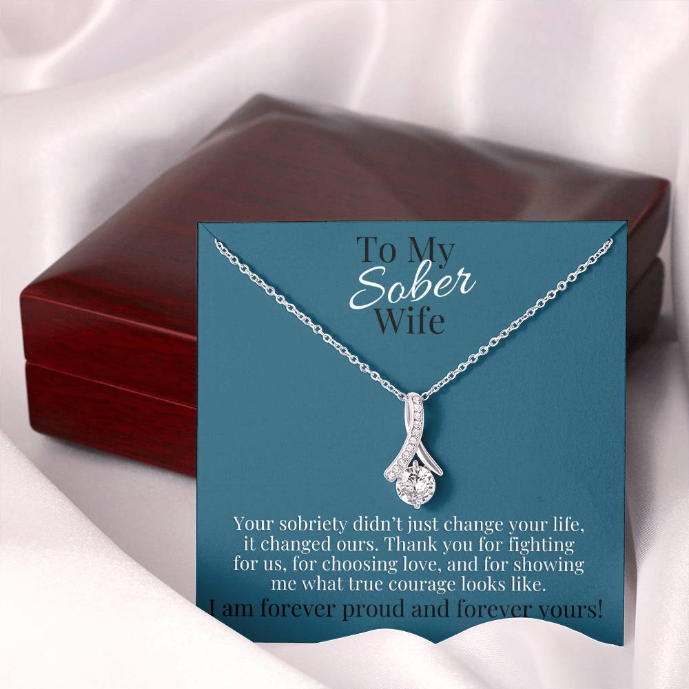 Silver-tone teardrop pendant necklace in gift box with blue card backing