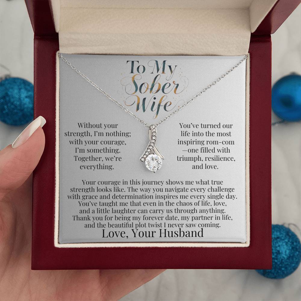 Silver-tone teardrop pendant necklace in red-lined gift box