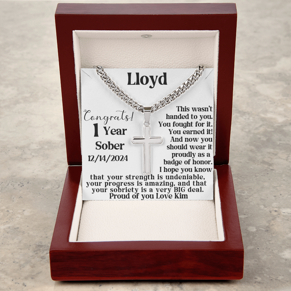 Silver chain necklace with cross pendant displayed in an open gift box