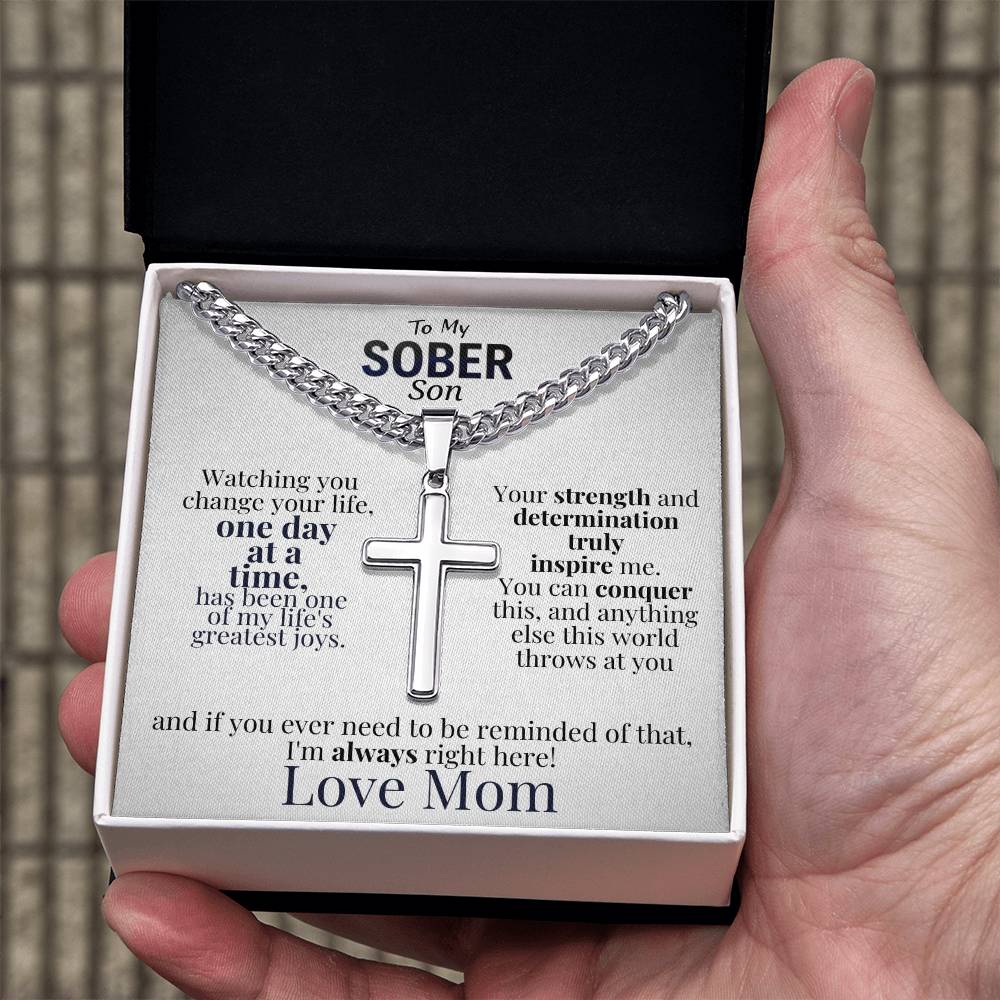 Cross necklace and message card in white insert gift box held in hand