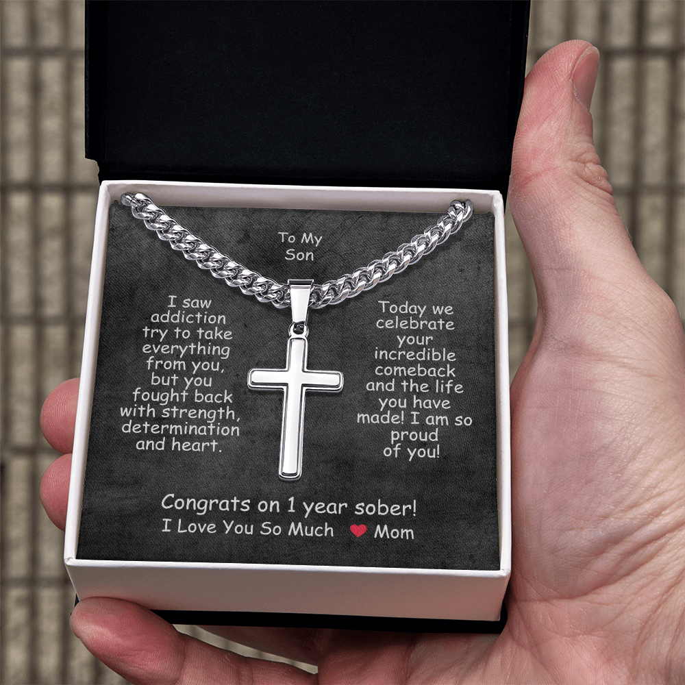 Cross pendant necklace in a black gift box.
