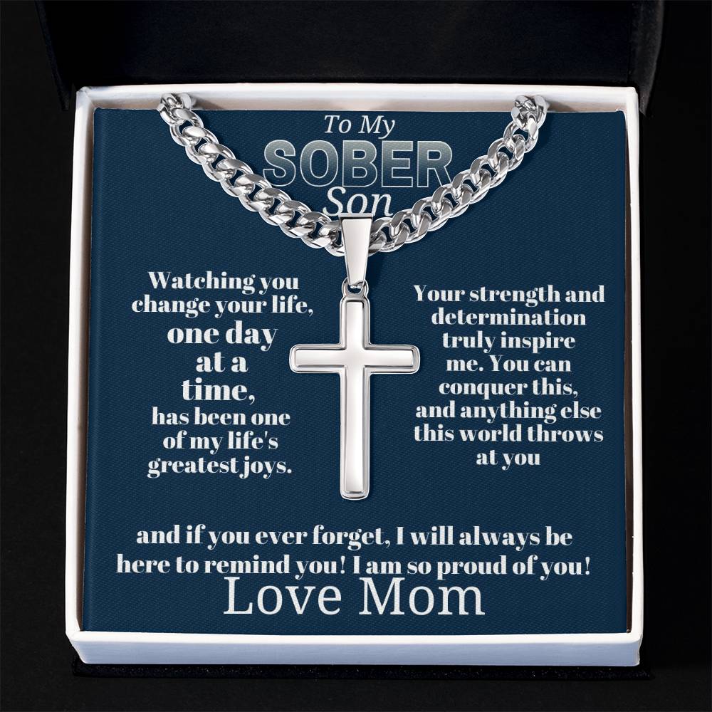Silver-tone curb chain cross pendant necklace displayed in gift box tray