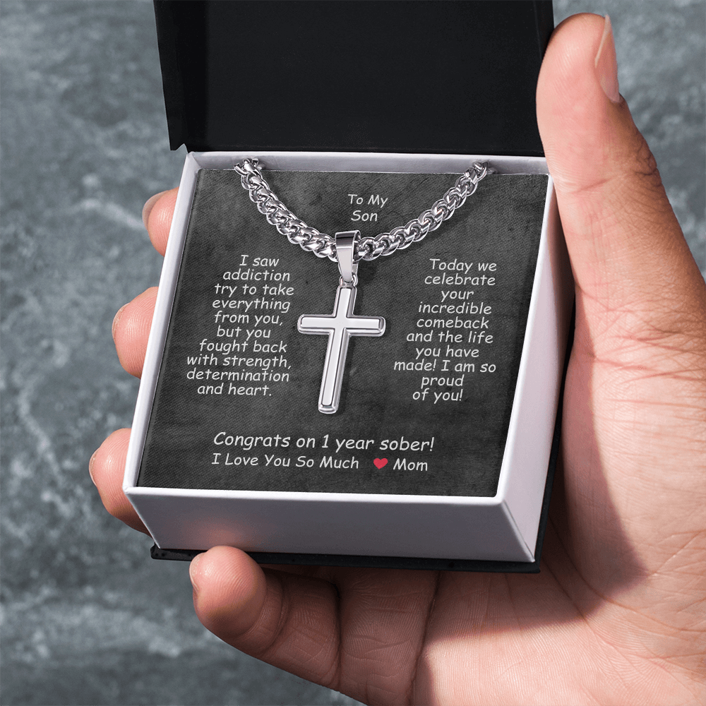 Cross pendant necklace in a white gift box with black insert.
