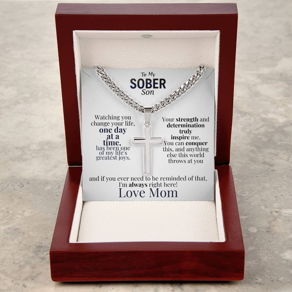 Cross necklace with message card in open red gift box