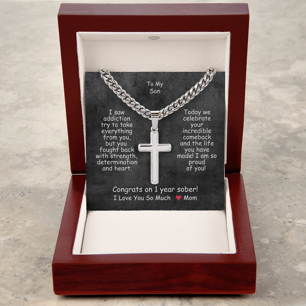 Cross pendant necklace in a red gift box with white insert.
