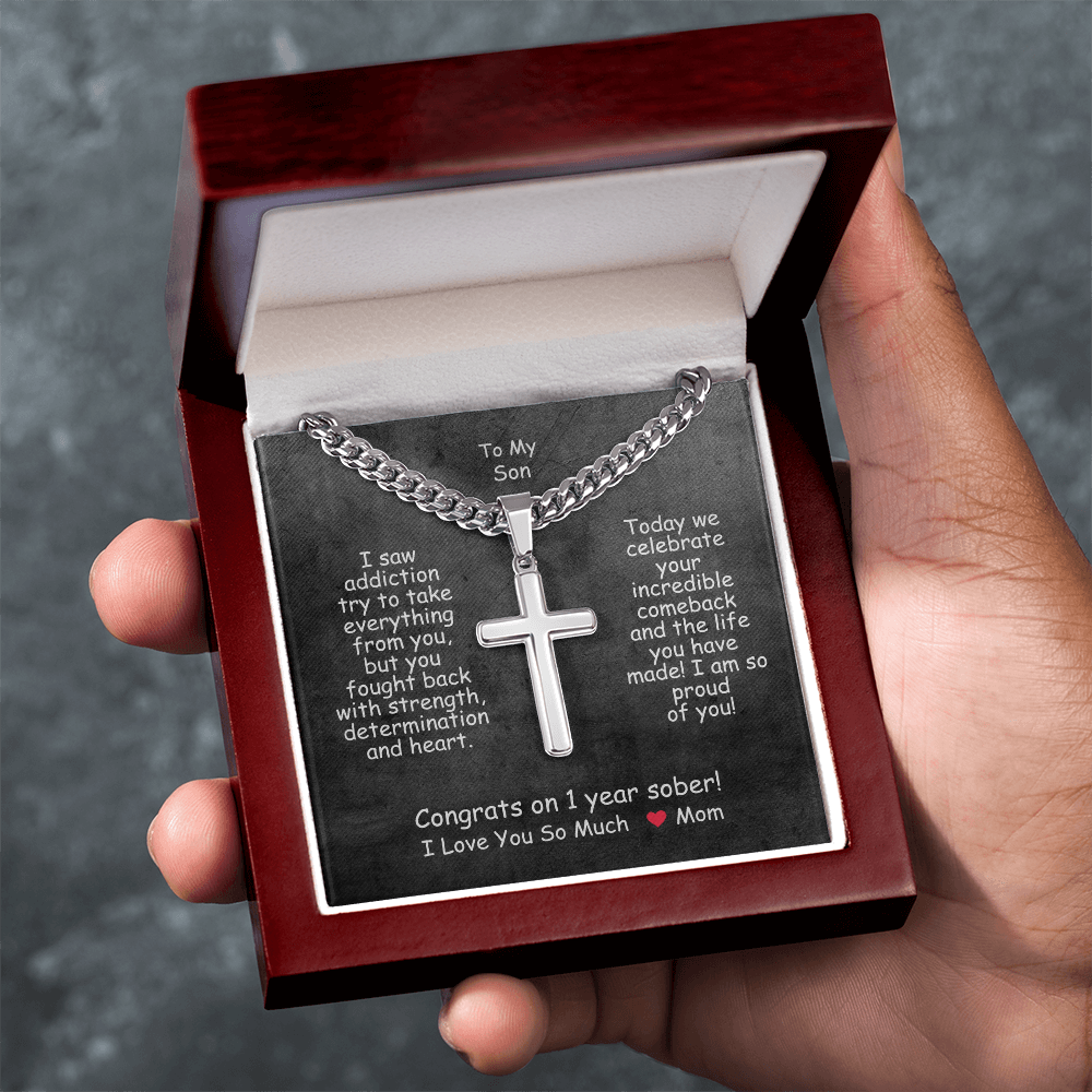 Cross pendant necklace in a red gift box with card insert.