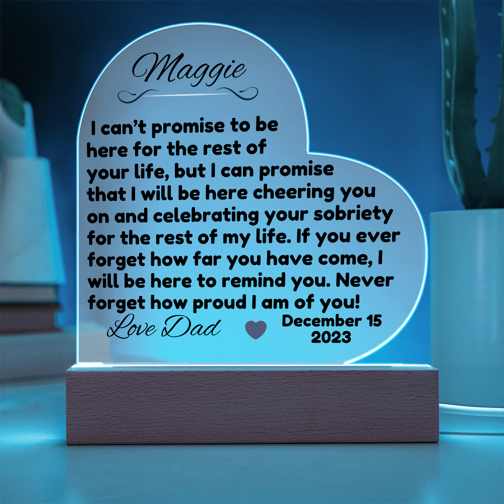 Acrylic LED heart sign with Maggie message, blue glow outline on wooden base