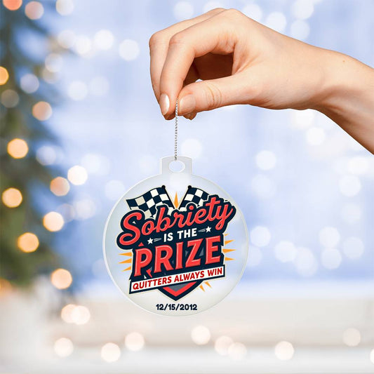 Round hanging ornament with “Sobriety Is The Prize” and checkered banner design