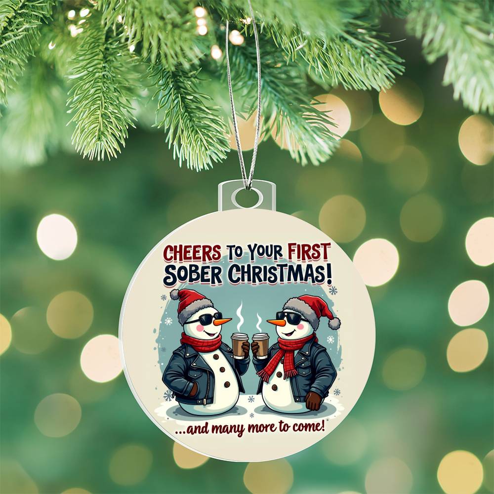 Round Christmas ornament with penguin couple graphic, hanging silver cord