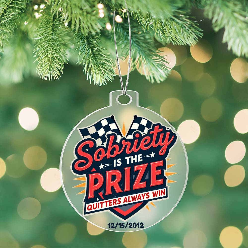 Round hanging ornament on pine branch with “Sobriety Is The Prize” text and star graphics