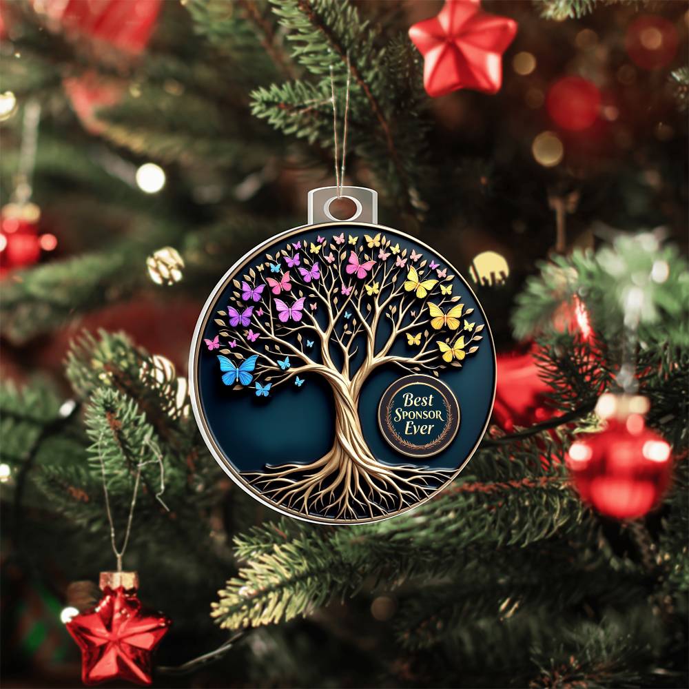 Acrylic tree ornament with butterflies, hanging on a Christmas tree branch