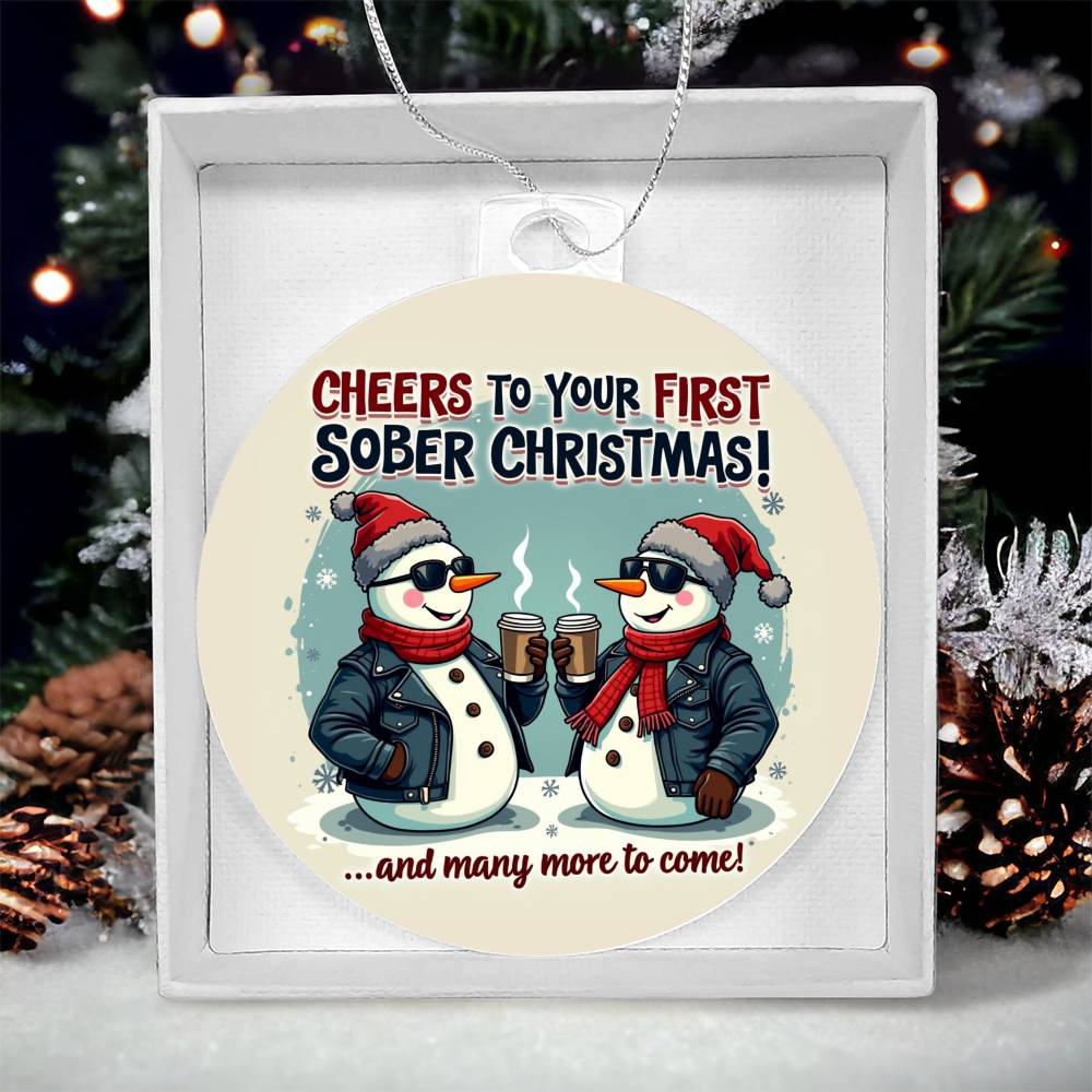 Round Christmas ornament with penguin couple graphic, in white gift box
