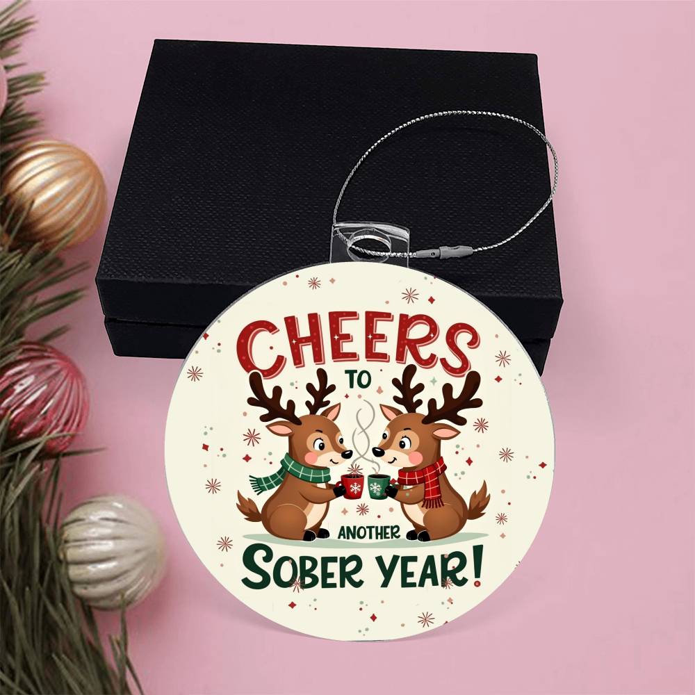 Round ornament with 'Cheers to Another Sober Year!' lettering and reindeer holding mugs