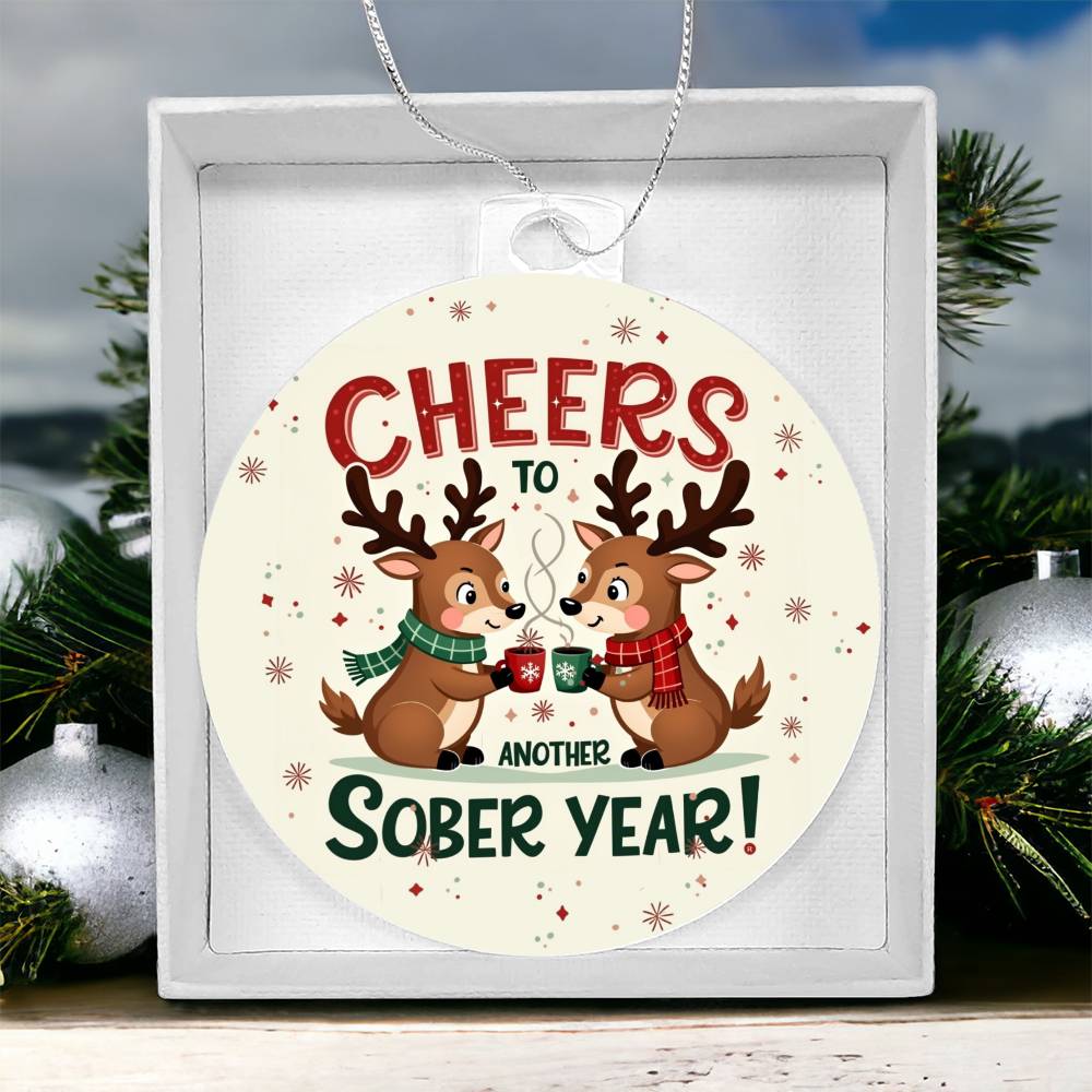 Round ornament in gift box: 'Cheers to Another Sober Year!' with reindeer mugs