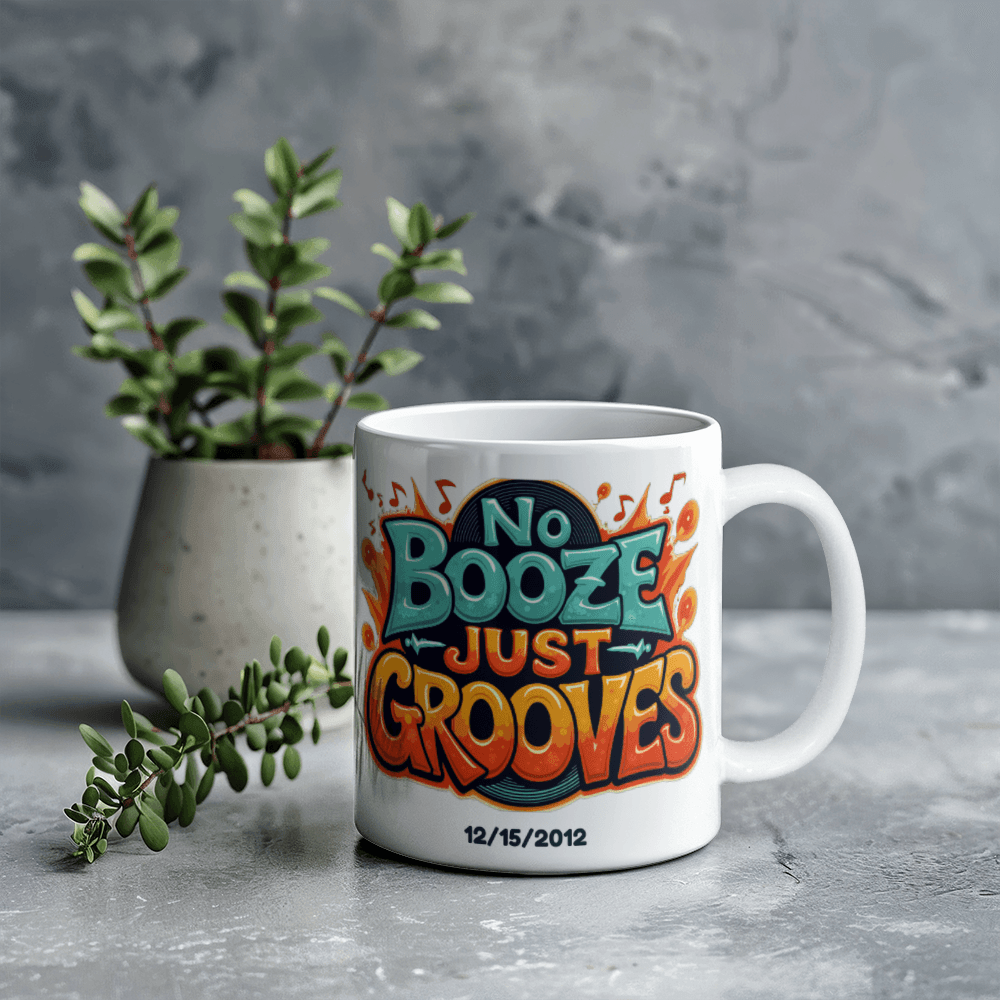 White ceramic mug on tabletop with 'No Booze Just Grooves' print and date 12/15/2012