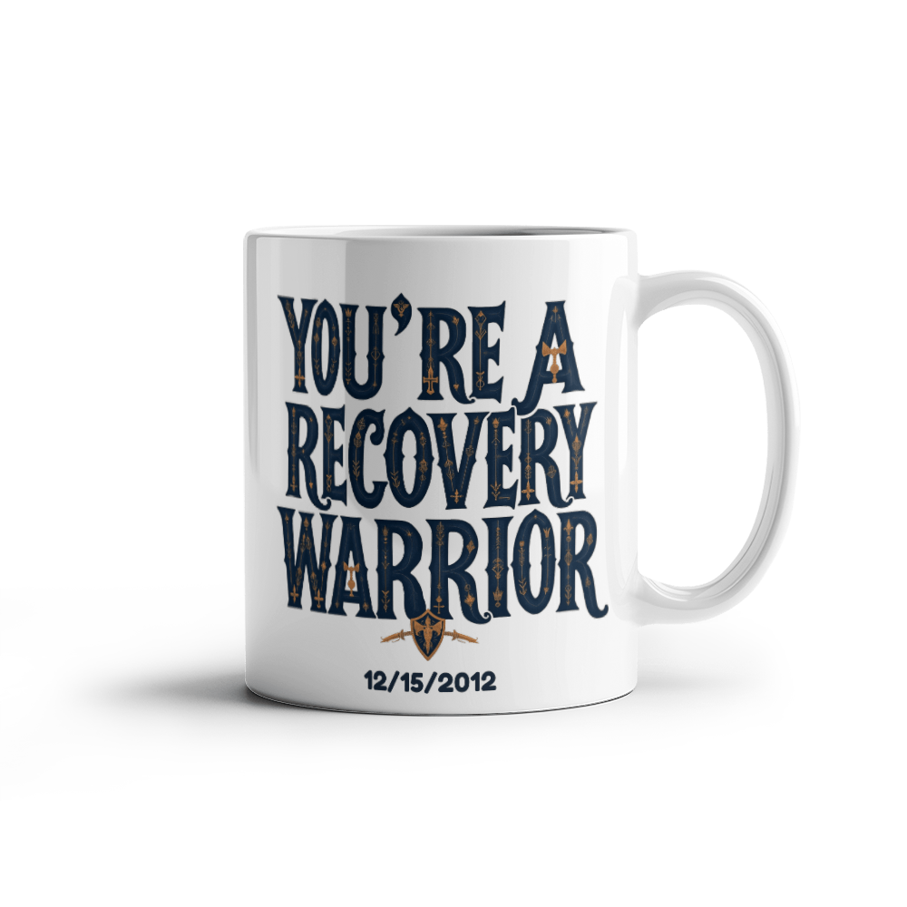 Front view of white ceramic coffee mug with “You’re a Recovery Warrior” and date
