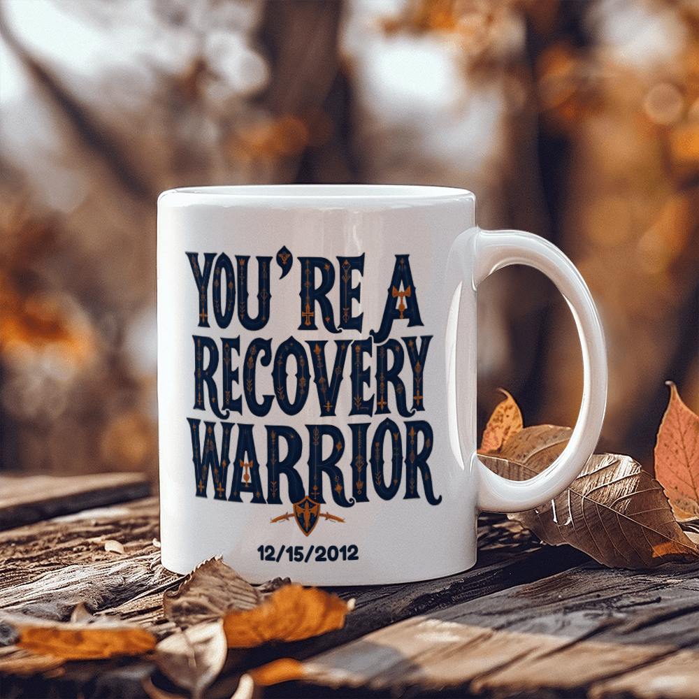 White coffee mug with “You’re a Recovery Warrior” design and “12/15/2012”