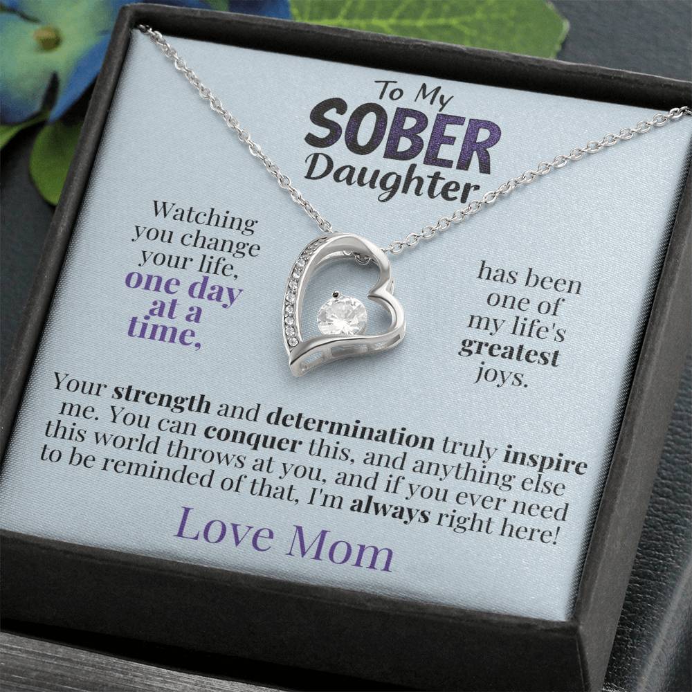 Silver heart pendant necklace on a message gift card