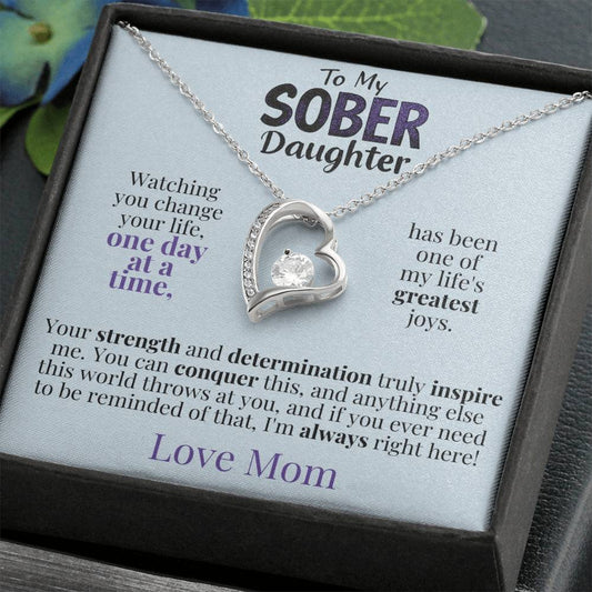 Silver heart pendant necklace on a message gift card
