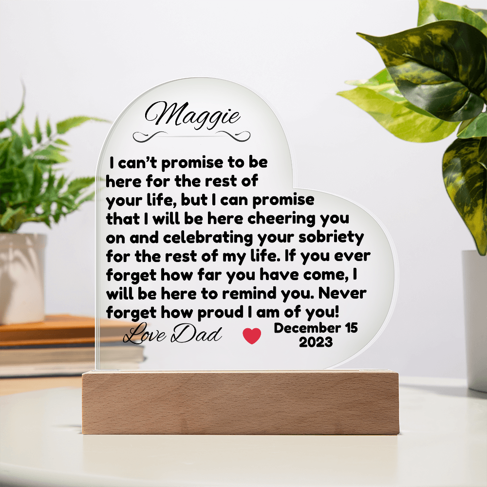 Acrylic LED heart sign with Maggie message on wooden base, clear stand support
