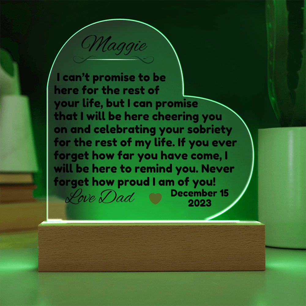 Acrylic LED heart sign with Maggie message, green glow outline on wooden base