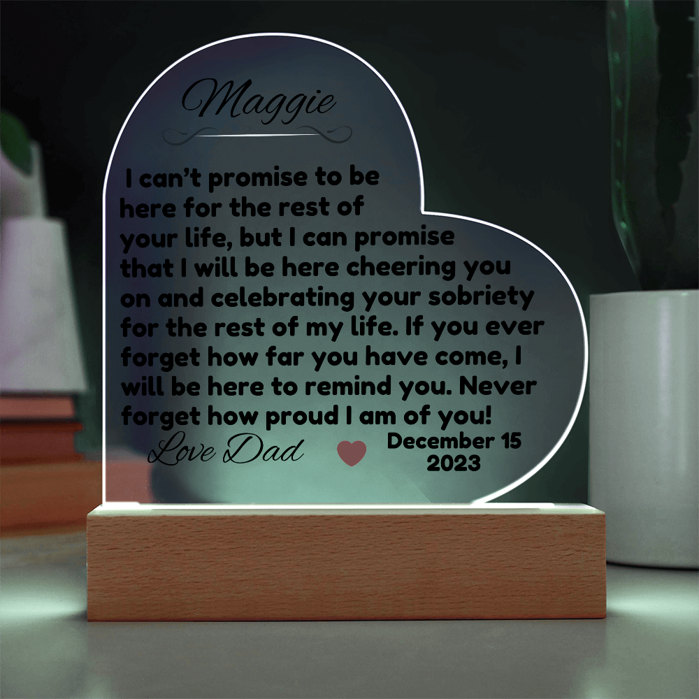 Acrylic LED heart sign with Maggie message, cool white glow outline on wooden base