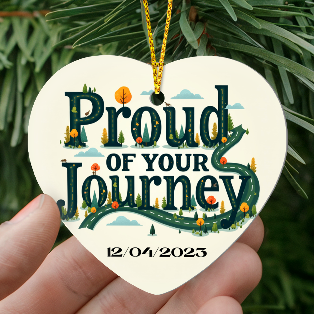Heart ornament showing “Proud of your Journey” and “12/04/2023” on white background.