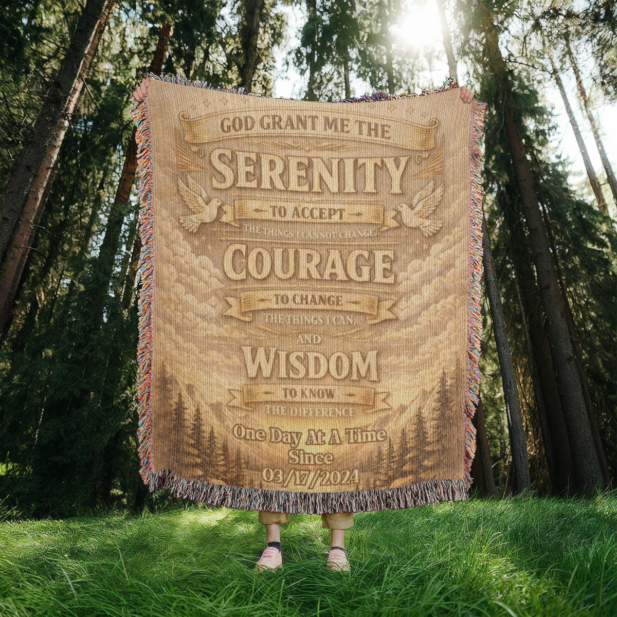 Tan woven blanket with fringe edge and Serenity, Courage, Wisdom typography centered