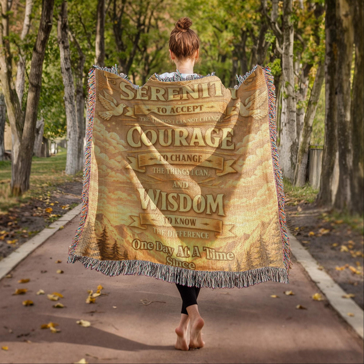 Tan woven prayer blanket with fringed trim showing Serenity and Courage wording