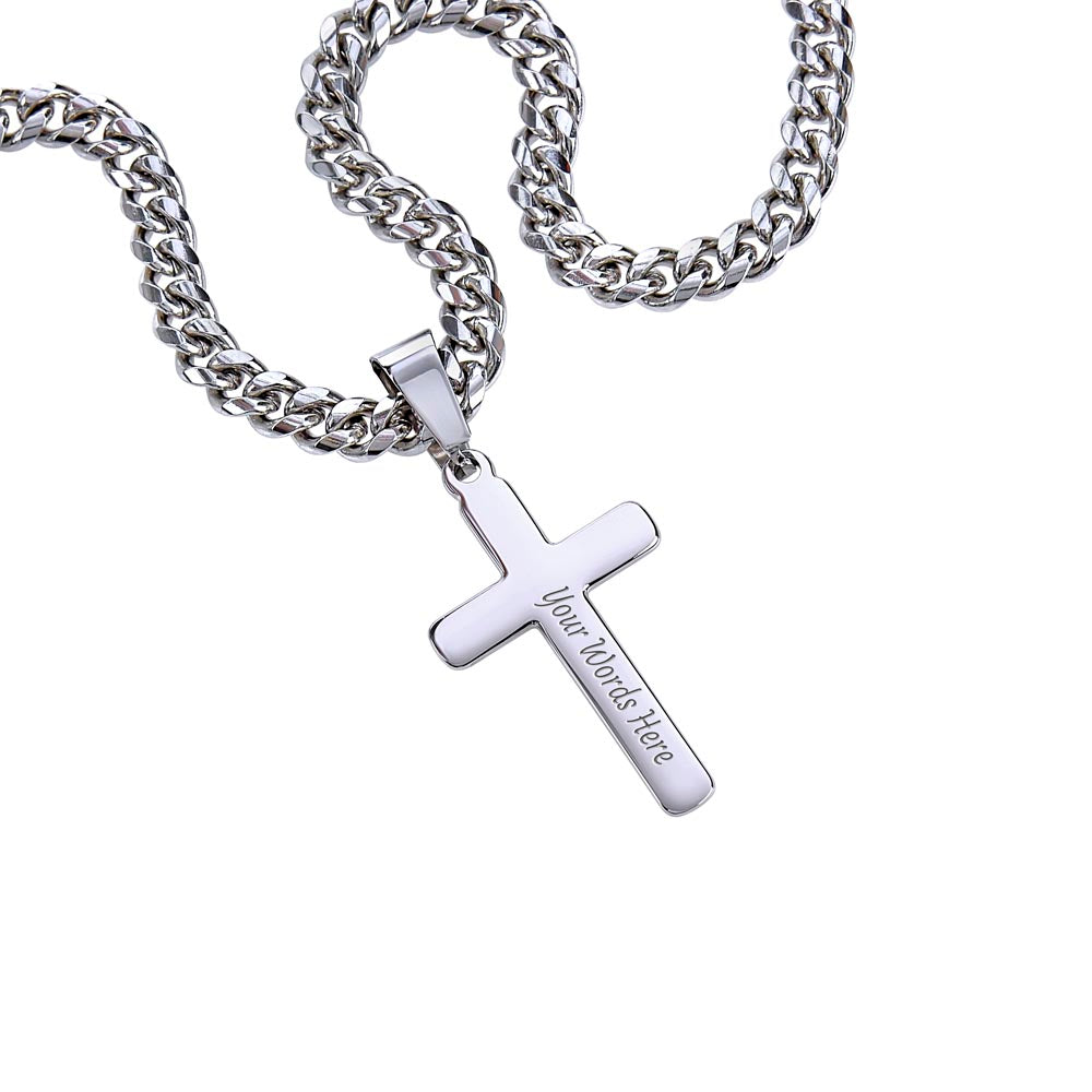 Silver cross pendant necklace on a curb chain, close-up of cross charm