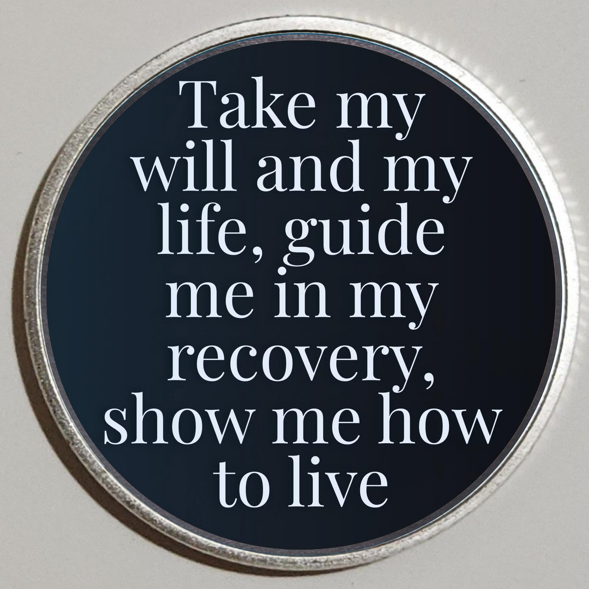 Round recovery coin with dark center and quote: Take my will and life