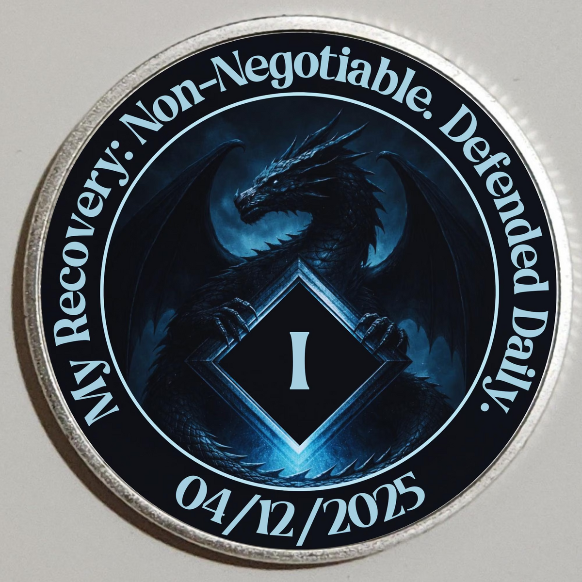 Round recovery coin with dark blue dragon emblem, “Non-Negotiable” text and date 04/12/2025.