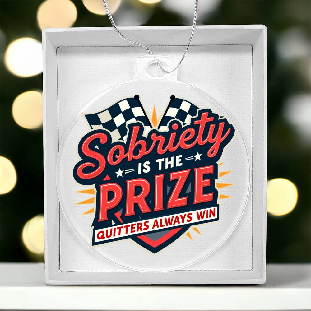 Round slogan ornament in gift box; white design with bold Sobriety Is The Prize text